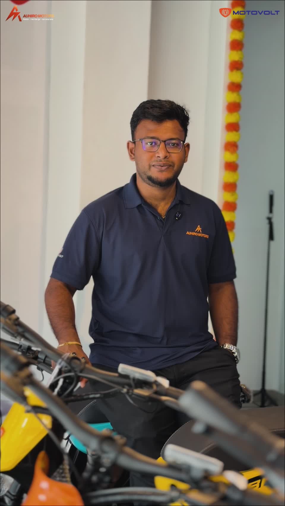 Auhiro Motors representative in the showroom